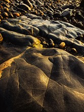 Rocks and pebbles on beach in Acadia National Park