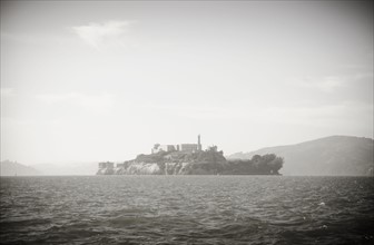Silhouette of island on sea