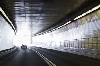 Car driving in tunnel