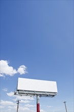 Blank billboard against blue sky