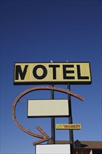 Motel sign against clear sky