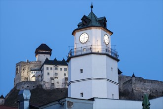Illuminated clock tower at dusk