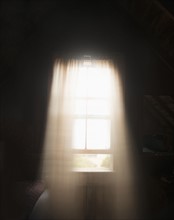 Light colored curtains in window