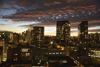 Dramatic sky over city at dusk