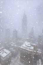 Empire State Building during blizzard. New York City, New York, USA.
