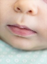 Close-up of baby boy's (2-5 months) mouth.