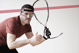 Man playing squash.