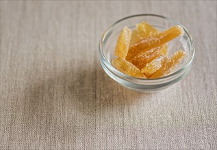Candied ginger in glass bowl