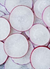 White slices of radish