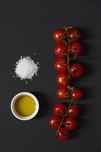 Cherry tomatoes, salt and olive oil