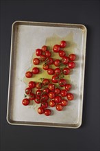 Cherry tomatoes on baking sheet