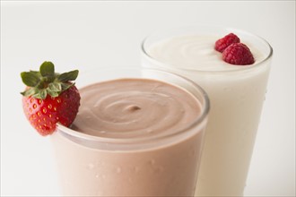 Raspberry and vanilla smoothies decorated with strawberries