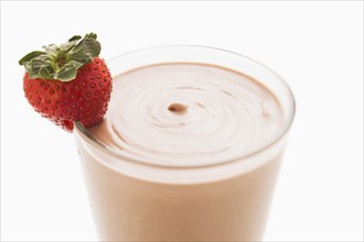 Chocolate smoothie in glass decorated with strawberry