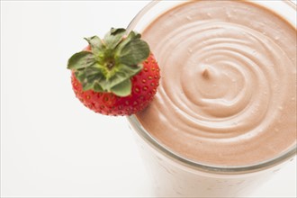 Chocolate smoothie in glass decorated with strawberry