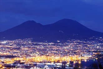 City under Mount Vesuvius at night