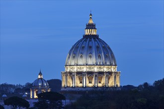 Illuminated St. Peter's Basilica at dusk