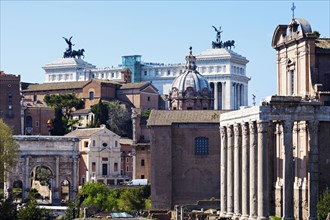Roman Forum and Monument of Vittorio Emanuele II against blue sky