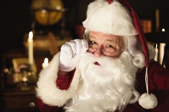 Portrait of Santa Claus wearing eyeglasses.