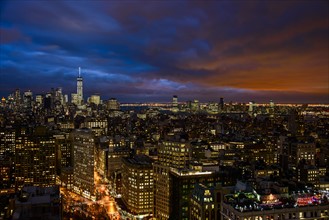 Illuminated cityscape at night. USA, New York, New York City.
