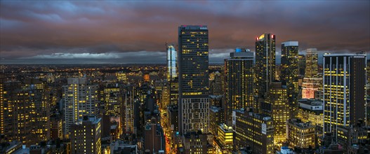 Illuminated cityscape at night. USA, New York, New York City.