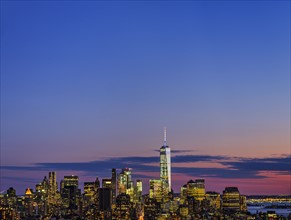 Skyline of New York at dusk with view of One World Trade Center. USA, New York, New York City.