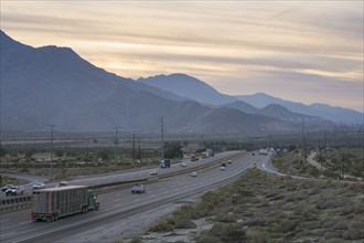 I-10 highway along mountains at sunset