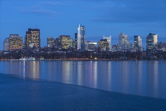 Charles river and illuminated downtown district at dusk