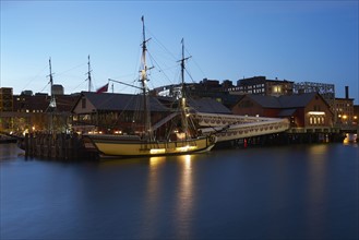 Tall ship and museum at dawn