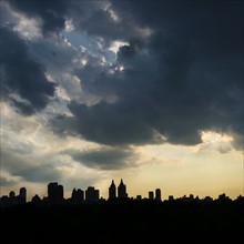 West Side of Manhattan, Silhouette of urban skyline at sunset.
