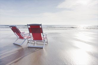 Maine, Red deckchairs on empty beach