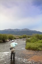Colorado, Mid adult man fishing in river