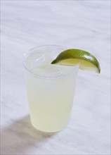 Margarita with lime on marble table