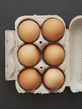 Overhead view of eggs in carton