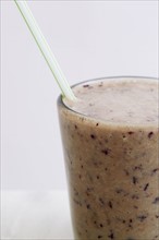 Close-up of banana and blueberry smoothie
