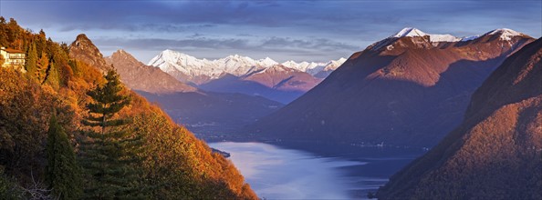 Switzerland, Lugano, Horizontal panorama of mountains and lake at sunset