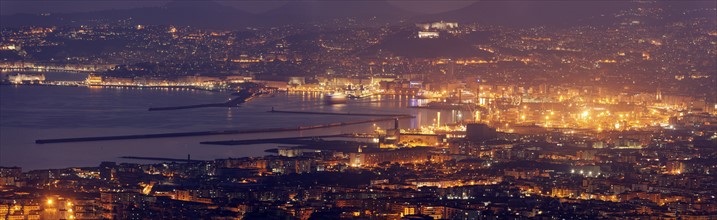 Italy, Campania, Naples, Panorama of city at night
