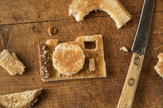 Camera shaped toast bread on cutting board.