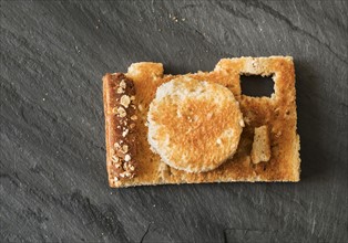 Camera shaped toast bread on table.