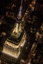 USA, New York, New York City, Aerial view of illuminated Empire State Building at night.