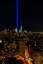 USA, New York State, New York City, Cityscape with light beam over ground zero.