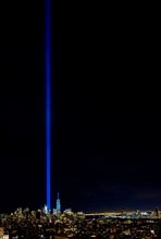 USA, New York State, New York City, Cityscape with light beam over ground zero.