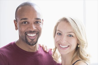 Portrait of happy multi ethnic couple.