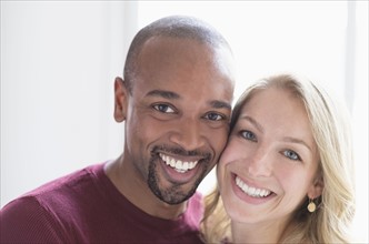 Portrait of happy multi ethnic couple.