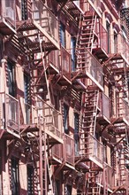 USA, New York State, New York City, Fire escapes on building facade