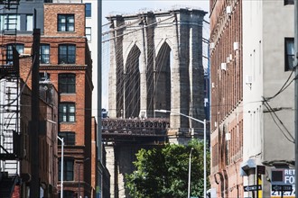 USA, New York State, New York City, Brooklyn Bridge arches seen from between buildings