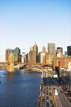 USA, New York State, New York City, Manhattan, Franklin D. Roosevelt East River Drive and Brooklyn Bridge at sunset