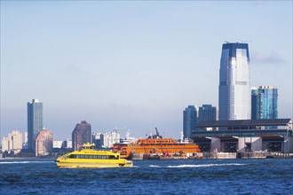 USA, New York State, New York City, Skyscrapers with yellow ship in foreground