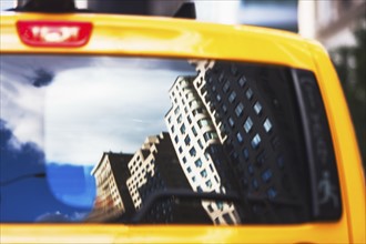 USA, New York State, New York City, Manhattan, Townhouses reflecting in cab's window