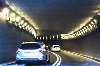 USA, New York, New York City, Manhattan, Cars riding in tunnel