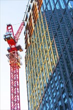 USA, New York, New York City, Office building next to crane